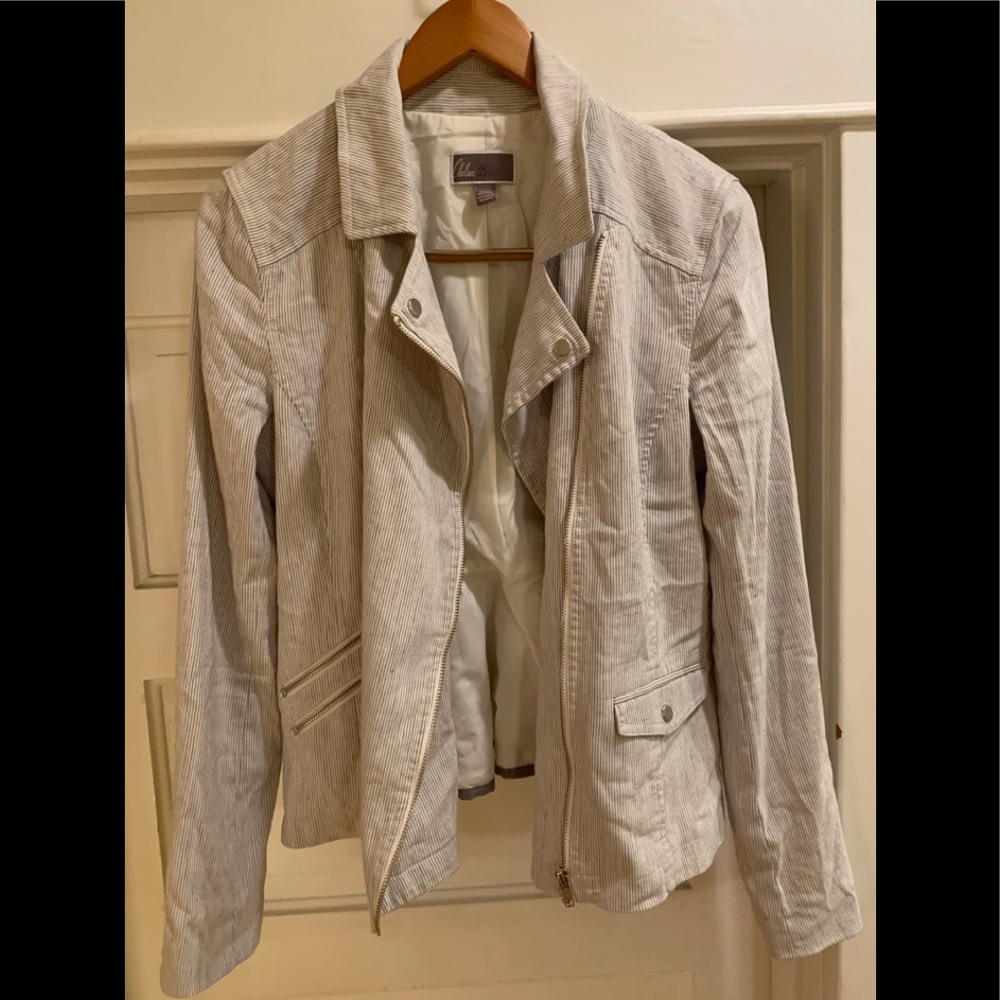 Cute ruffle back lined jacket. Steam and go for work play. Cute with jeans!.